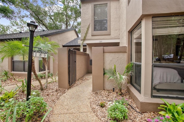 940 Douglas Ave Unit 189, Altamonte Springs, FL 32714 - view of side of property with stucco siding and a gate
