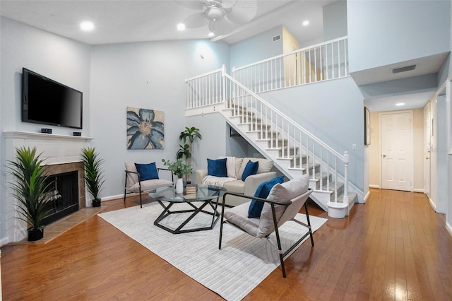 940 Douglas Ave Unit 189, Altamonte Springs, FL 32714 - living room with stairway, a high ceiling, a ceiling fan, wood finished floors, and recessed lighting