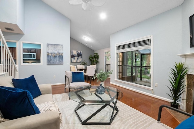 940 Douglas Ave Unit 189, Altamonte Springs, FL 32714 - living room featuring lofted ceiling, wood finished floors, stairway, and ceiling fan