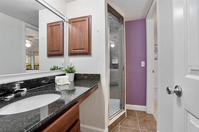 940 Douglas Ave Unit 189, Altamonte Springs, FL 32714 - full bathroom featuring vanity, a stall shower, tile patterned flooring, and a ceiling fan