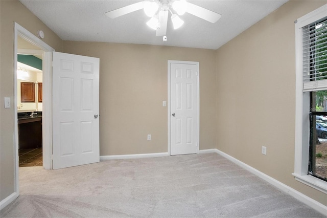 940 Douglas Ave Unit 189, Altamonte Springs, FL 32714 - unfurnished bedroom with carpet floors, connected bathroom, and a ceiling fan