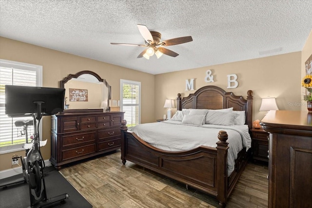 3132 Mango Tree Dr, Edgewater, FL 32141 - bedroom with wood finished floors, a textured ceiling, and ceiling fan