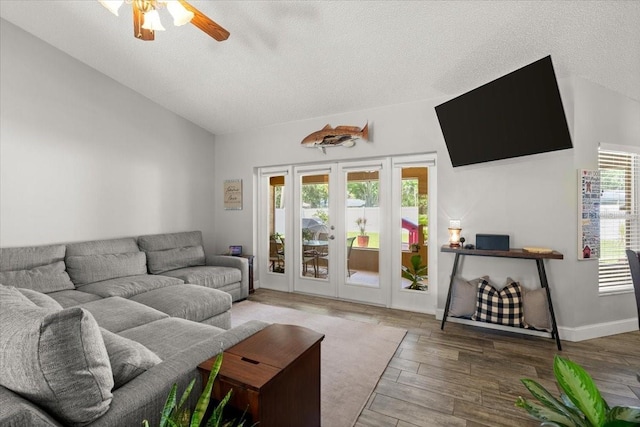 3132 Mango Tree Dr, Edgewater, FL 32141 - living room with lofted ceiling, a ceiling fan, wood finished floors, and a textured ceiling