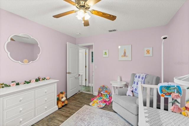 3132 Mango Tree Dr, Edgewater, FL 32141 - bedroom with dark wood-type flooring, a textured ceiling, and a ceiling fan