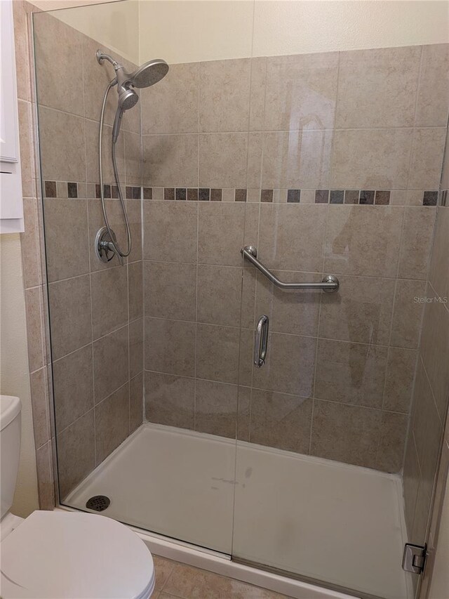 223 W Fiesta Key Loop, Deland, FL 32720 - bathroom featuring a shower stall and tile patterned floors