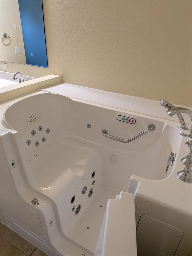 223 W Fiesta Key Loop, Deland, FL 32720 - full bath with a whirlpool tub and tile patterned flooring