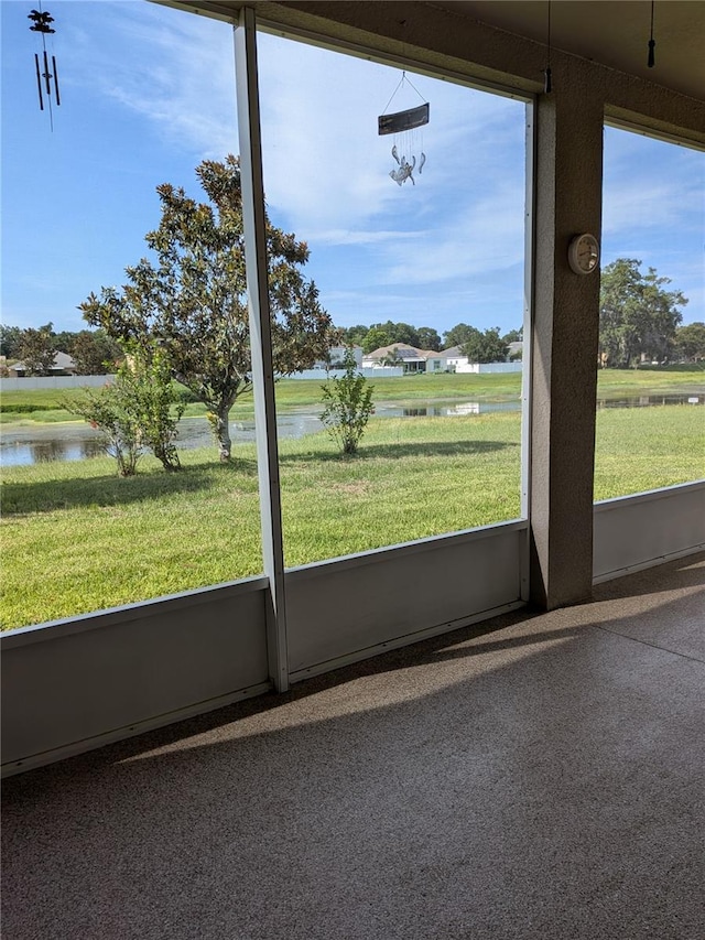 223 W Fiesta Key Loop, Deland, FL 32720 - unfurnished sunroom with a water view
