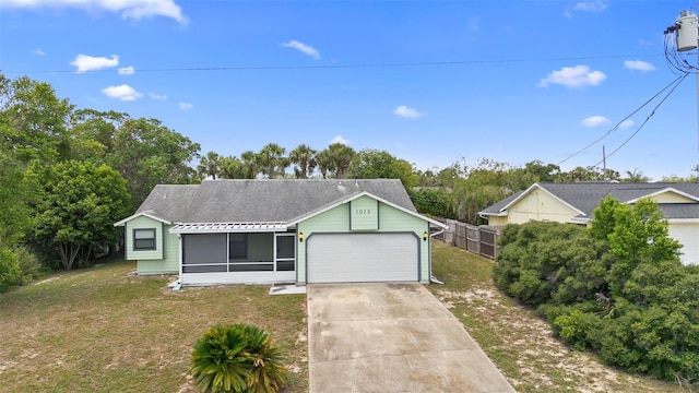 1018 E Gaucho Cir, Deltona, FL 32725 - single story home with a garage, a sunroom, and concrete driveway