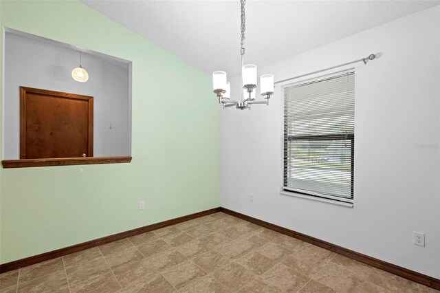 1018 E Gaucho Cir, Deltona, FL 32725 - unfurnished room featuring a chandelier and baseboards