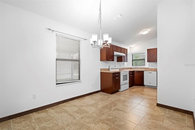 1018 E Gaucho Cir, Deltona, FL 32725 - kitchen with white appliances, under cabinet range hood, a chandelier, baseboards, and vaulted ceiling