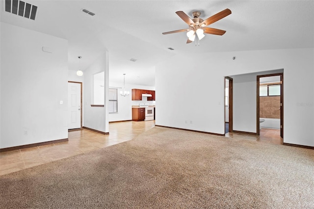 1018 E Gaucho Cir, Deltona, FL 32725 - unfurnished living room featuring light carpet, ceiling fan, baseboards, light tile patterned floors, and high vaulted ceiling
