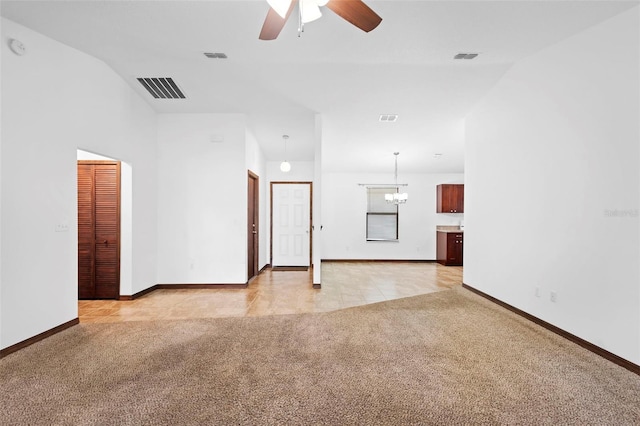 1018 E Gaucho Cir, Deltona, FL 32725 - spare room featuring light carpet, ceiling fan, baseboards, and a chandelier