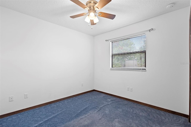 1018 E Gaucho Cir, Deltona, FL 32725 - unfurnished room with dark carpet, baseboards, a ceiling fan, a textured ceiling, and a smoke detector