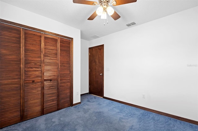 1018 E Gaucho Cir, Deltona, FL 32725 - unfurnished bedroom featuring carpet flooring, a closet, baseboards, and a ceiling fan