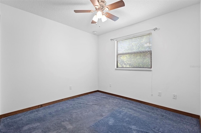 1018 E Gaucho Cir, Deltona, FL 32725 - unfurnished room featuring dark carpet, baseboards, ceiling fan, and a textured ceiling