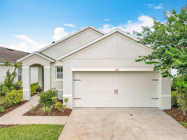 422 Armoyan Way, New Smyrna Beach, FL 32168 - ranch-style home featuring an attached garage, concrete driveway, and stucco siding