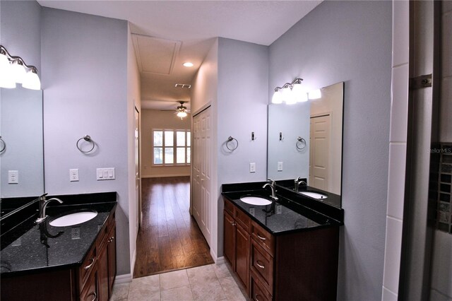 201 Walter Stevens Way, Deland, FL 32724 - bathroom featuring two vanities, tile patterned floors, and a ceiling fan