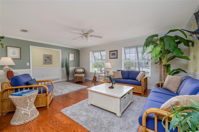 179 Ann Rustin Dr S, Ormond Beach, FL 32176 - living area featuring ornamental molding, a ceiling fan, wood finished floors, and a wainscoted wall