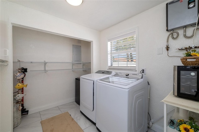 179 Ann Rustin Dr S, Ormond Beach, FL 32176 - washroom with independent washer and dryer, light marble finish flooring, electric panel, and water heater
