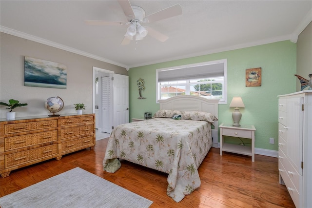 179 Ann Rustin Dr S, Ormond Beach, FL 32176 - bedroom with ornamental molding, wood finished floors, baseboards, and ceiling fan