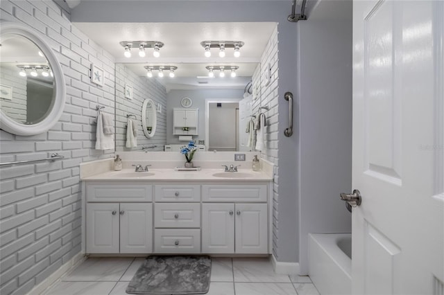 179 Ann Rustin Dr S, Ormond Beach, FL 32176 - bathroom featuring double vanity, marble finish flooring, ornamental molding, and baseboards