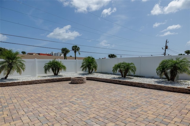 179 Ann Rustin Dr S, Ormond Beach, FL 32176 - fenced backyard featuring an outdoor fire pit and a patio area