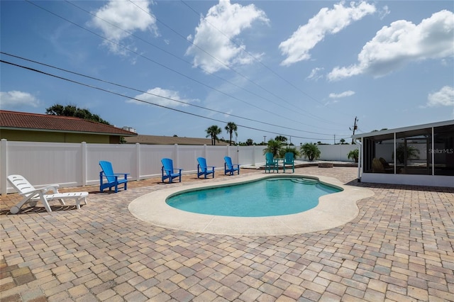 179 Ann Rustin Dr S, Ormond Beach, FL 32176 - view of swimming pool with a patio, a sunroom, and a fenced backyard