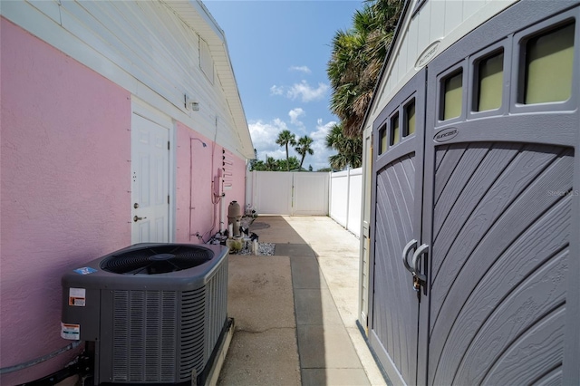179 Ann Rustin Dr S, Ormond Beach, FL 32176 - view of home's exterior with central AC unit, a fenced backyard, a patio, and stucco siding