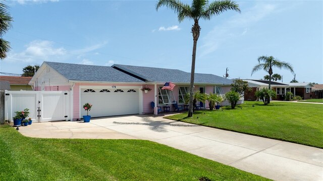 179 Ann Rustin Dr S, Ormond Beach, FL 32176 - single story home featuring a gate, a garage, driveway, and a shingled roof