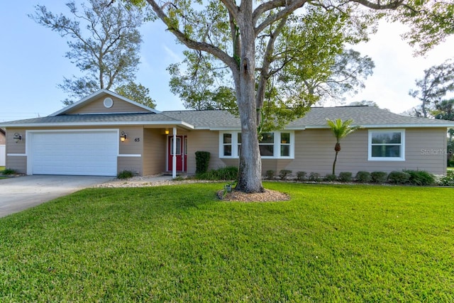 65 Sycamore Cir, Ormond Beach, FL 32174 - ranch-style house with a garage, concrete driveway, a front yard, and a shingled roof
