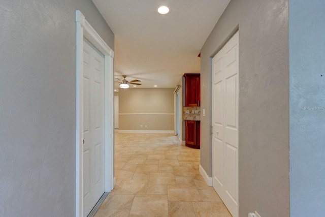65 Sycamore Cir, Ormond Beach, FL 32174 - hall with stone finish flooring, baseboards, and recessed lighting