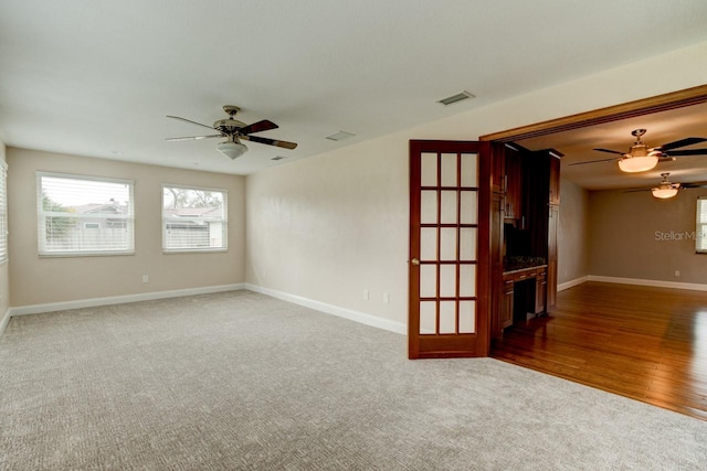 65 Sycamore Cir, Ormond Beach, FL 32174 - carpeted spare room featuring a ceiling fan and baseboards