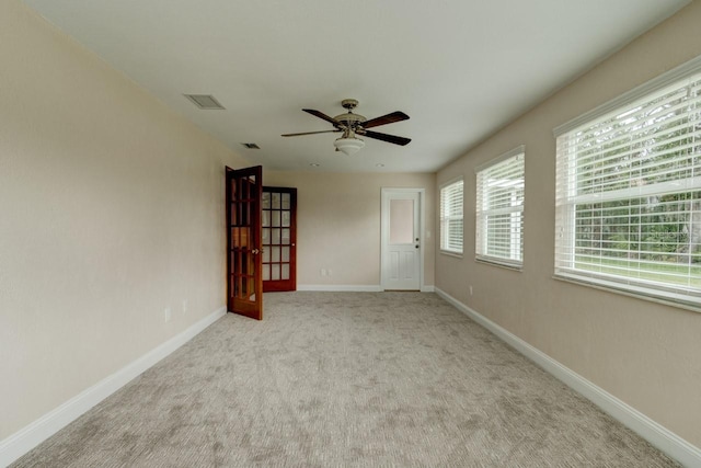 65 Sycamore Cir, Ormond Beach, FL 32174 - empty room with carpet, ceiling fan, and baseboards