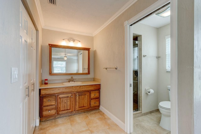 65 Sycamore Cir, Ormond Beach, FL 32174 - bathroom with toilet, vanity, plenty of natural light, crown molding, and a ceiling fan