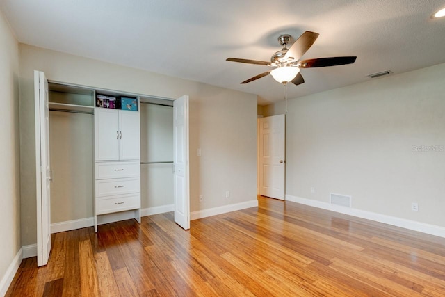 65 Sycamore Cir, Ormond Beach, FL 32174 - unfurnished bedroom with light wood-style flooring, a closet, and baseboards