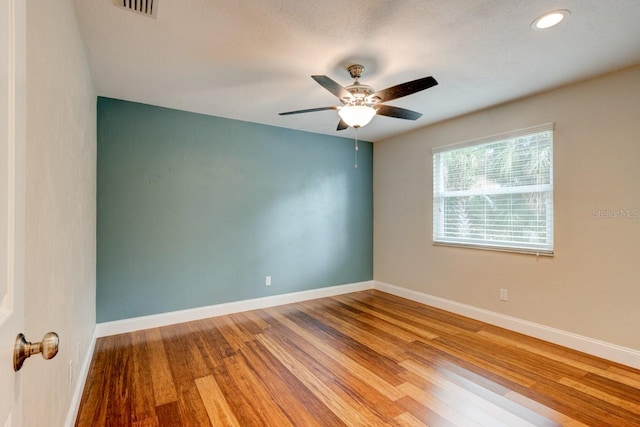 65 Sycamore Cir, Ormond Beach, FL 32174 - empty room with baseboards, ceiling fan, wood finished floors, and recessed lighting