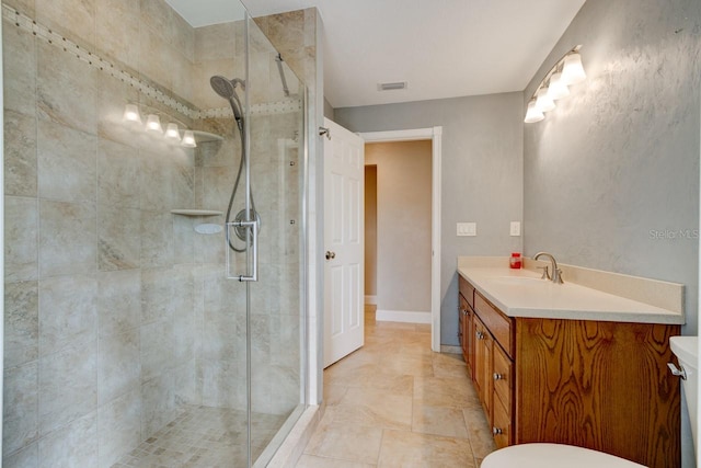 65 Sycamore Cir, Ormond Beach, FL 32174 - full bathroom with a stall shower, vanity, baseboards, and toilet