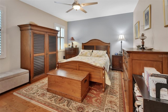 202 W Chancery Ln, Deland, FL 32724 - bedroom with wood finished floors and a ceiling fan