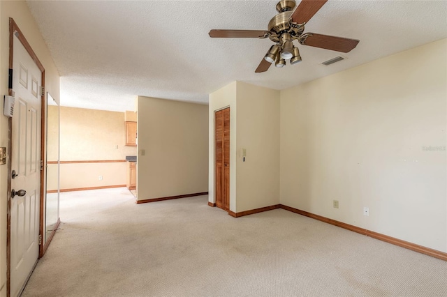 840 Center Ave Unit 280, Daytona Beach, FL 32117 - spare room featuring light colored carpet, a ceiling fan, and a textured ceiling
