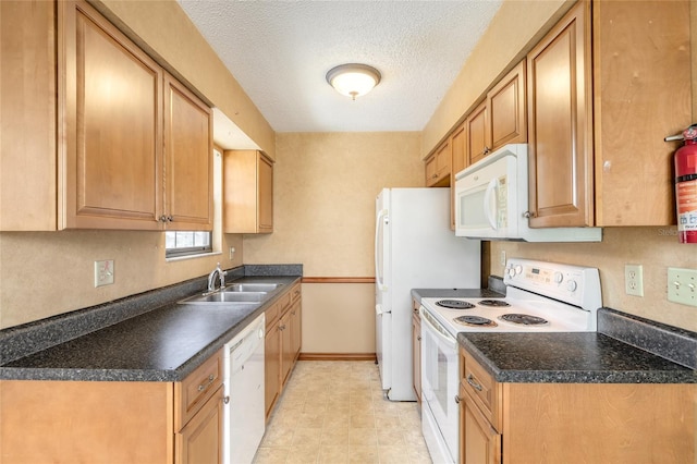 840 Center Ave Unit 280, Daytona Beach, FL 32117 - kitchen with white appliances, dark countertops, and a textured ceiling