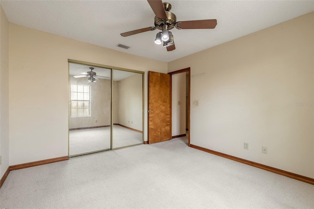 840 Center Ave Unit 280, Daytona Beach, FL 32117 - unfurnished bedroom with carpet, a closet, ceiling fan, and a textured ceiling