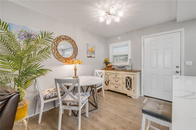 10 Lynnhurst Dr Unit 1050, Ormond Beach, FL 32176 - dining space with light wood-style floors and a chandelier