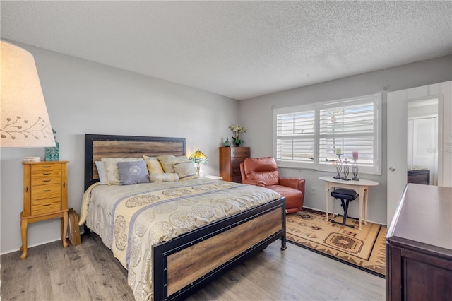 10 Lynnhurst Dr Unit 1050, Ormond Beach, FL 32176 - bedroom featuring light wood-style floors and a textured ceiling