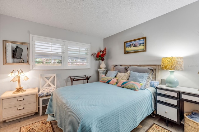 10 Lynnhurst Dr Unit 1050, Ormond Beach, FL 32176 - bedroom featuring wood finished floors and a textured ceiling