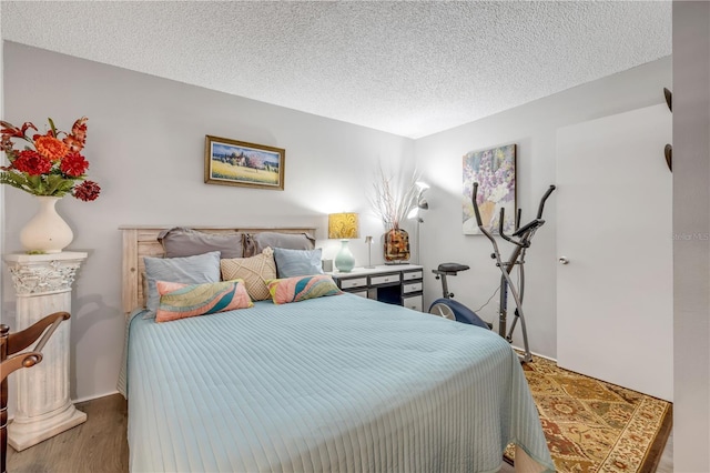 10 Lynnhurst Dr Unit 1050, Ormond Beach, FL 32176 - bedroom with a textured ceiling and wood finished floors
