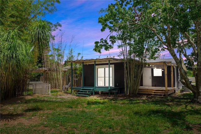 18 S Shell Rd, Debary, FL 32713 - rear view of property featuring an outbuilding