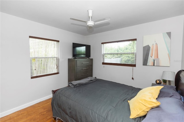 18 S Shell Rd, Debary, FL 32713 - bedroom with wood finished floors, baseboards, and a ceiling fan