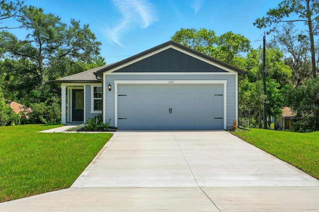 1161 Kenway Ave, Deltona, FL 32738 - single story home featuring a front yard, driveway, board and batten siding, and an attached garage