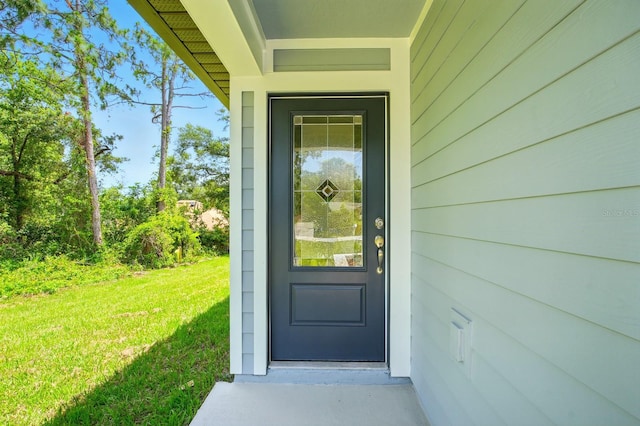 1161 Kenway Ave, Deltona, FL 32738 - property entrance featuring a lawn