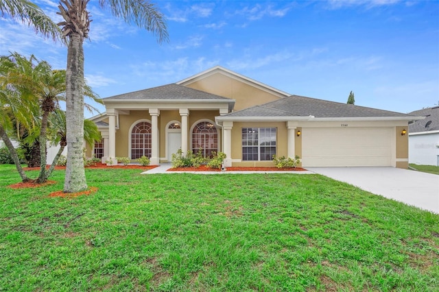 2263 Catbriar Way, Oviedo, FL 32765 - view of front of home featuring stucco siding, an attached garage, concrete driveway, a front yard, and a shingled roof